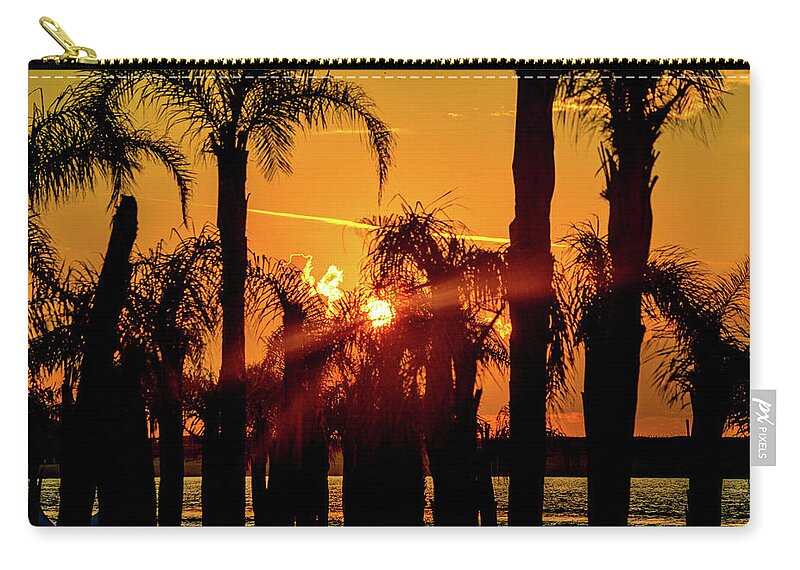 Alabama Zip Pouch featuring the photograph Stack of Palms in a Orange Sky by Michael Thomas