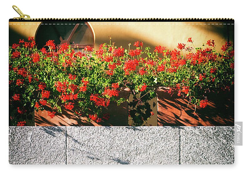 Architecture Zip Pouch featuring the photograph Stone bench with flowers by Silvia Ganora