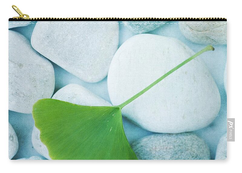 Priska Wettstein Zip Pouch featuring the photograph Stones And A Gingko Leaf by Priska Wettstein