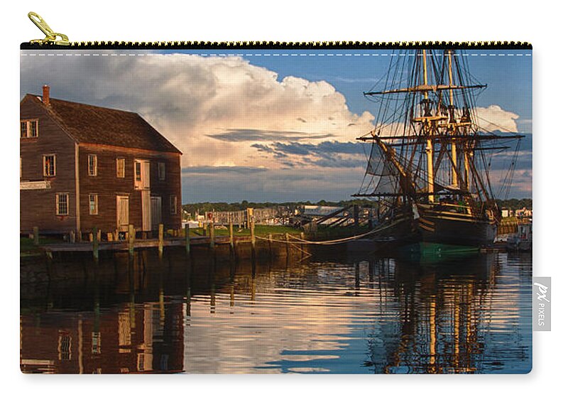 Salem Zip Pouch featuring the photograph Storm leaves reflection on Salem by Jeff Folger