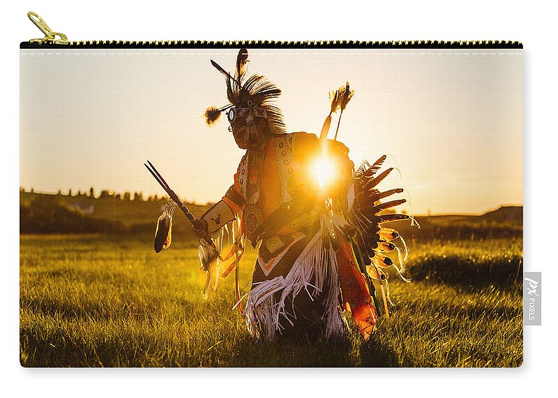 A Traditional Native American Indian Dances At Sunset At A Powwow In Montana. Zip Pouch featuring the photograph Sun Dance by Todd Klassy
