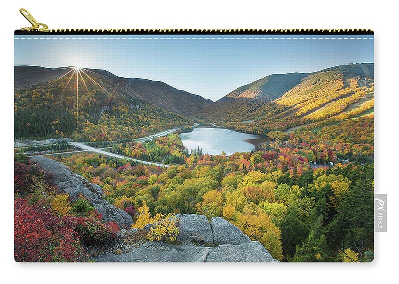 Sunburst Zip Pouch featuring the photograph Sunburst over Franconia Notch by White Mountain Images