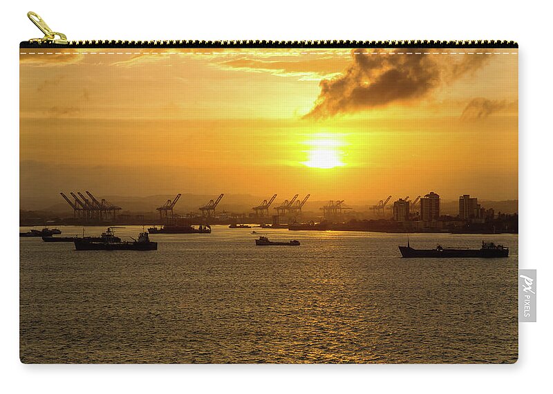 Travel Zip Pouch featuring the photograph Sunrise Over Colon by Arthur Dodd