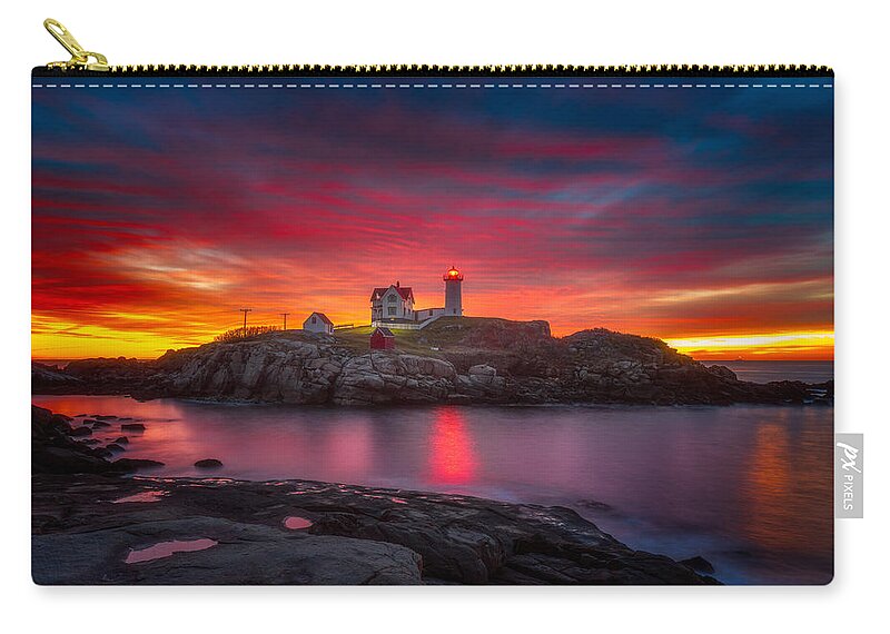 Sunrise Carry-all Pouch featuring the photograph Sunrise over Nubble Light by Darren White