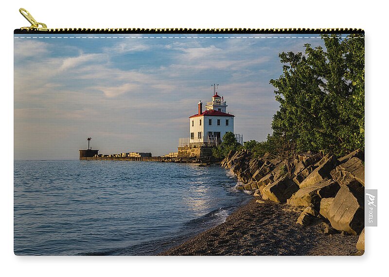 Sunset Fairport Harbor Lighthouse Zip Pouch featuring the photograph Sunset at Fairport Harbor Lighthouse by Dale Kincaid