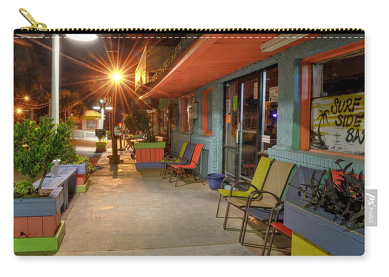 Surf Side Bar Zip Pouch featuring the photograph Surf Side Bar At Night by Greg and Chrystal Mimbs