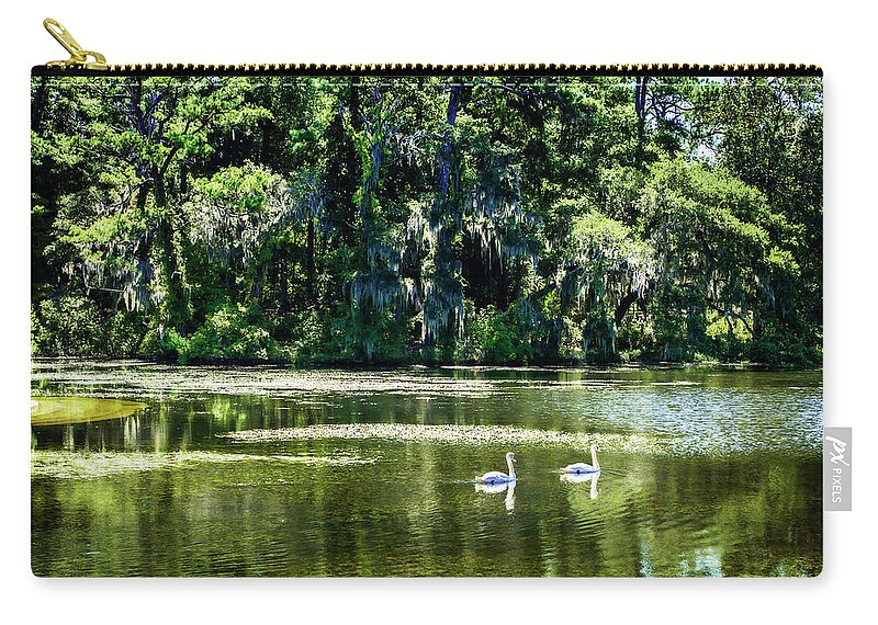 Color Zip Pouch featuring the photograph Swans -1 by Alan Hausenflock