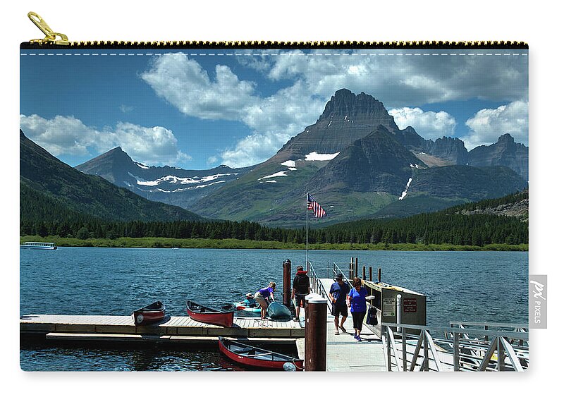 Glacier National Park Zip Pouch featuring the photograph Swiftcurrent Lake by Lee Santa