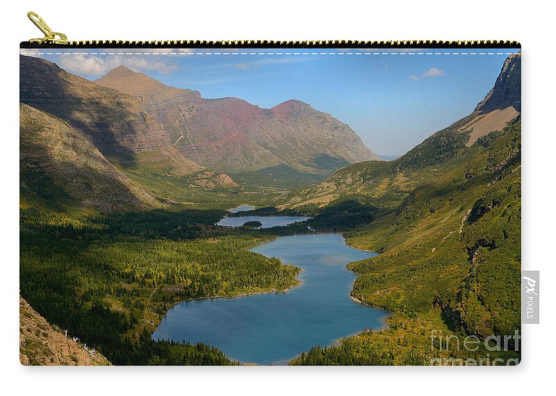 Swiftcurrent Pass Zip Pouch featuring the photograph Swiftcurrent Lakes Of Many Glacier by Adam Jewell