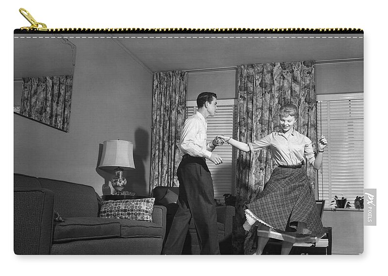 1950s Zip Pouch featuring the photograph Teen Couple Dancing At Home, C.1950s by Debrocke/ClassicStock