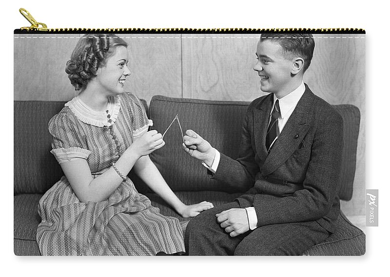 1930s Zip Pouch featuring the photograph Teen Couple Pulling Wishbone, C.1930s by H. Armstrong Roberts/ClassicStock