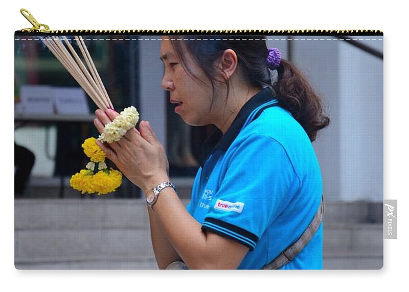 Woman Zip Pouch featuring the photograph Thai woman worships and prays at outdoor shrine altar Bangkok Thailand by Imran Ahmed