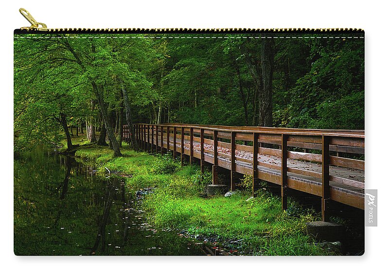 The Bridge At Wolfe Park Zip Pouch featuring the photograph The Bridge at Wolfe Park by Karol Livote