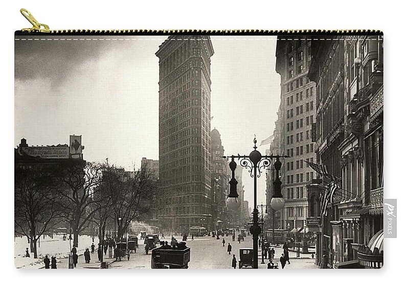Times Square Zip Pouch featuring the photograph The Flatiron Building by Jon Neidert