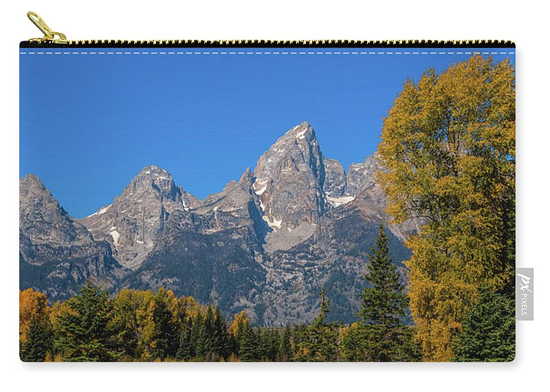 Grand Teton Mountain Range Zip Pouch featuring the photograph The Grand Teton colors by Yeates Photography
