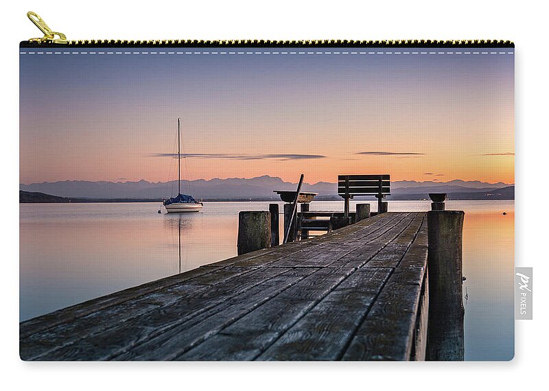 Ammersee Carry-all Pouch featuring the photograph The jetty to sunset by Hannes Cmarits