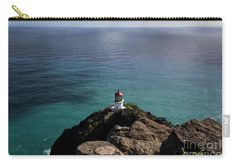The Lighthouse At Makapu Zip Pouch featuring the photograph The Lighthouse at Makapu'u by Mitch Shindelbower