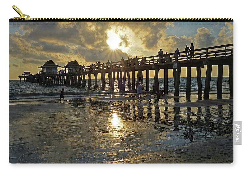 Naples Zip Pouch featuring the photograph Naples pier at sunset Naples Florida Ripples #1 by Toby McGuire