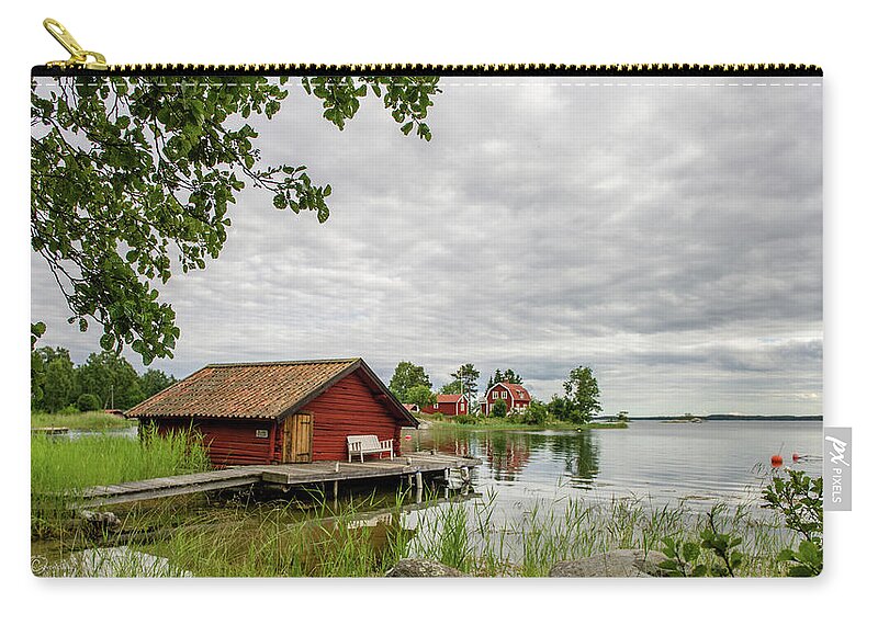 The Old Boat-house Carry-all Pouch featuring the photograph The old boat-house by Torbjorn Swenelius