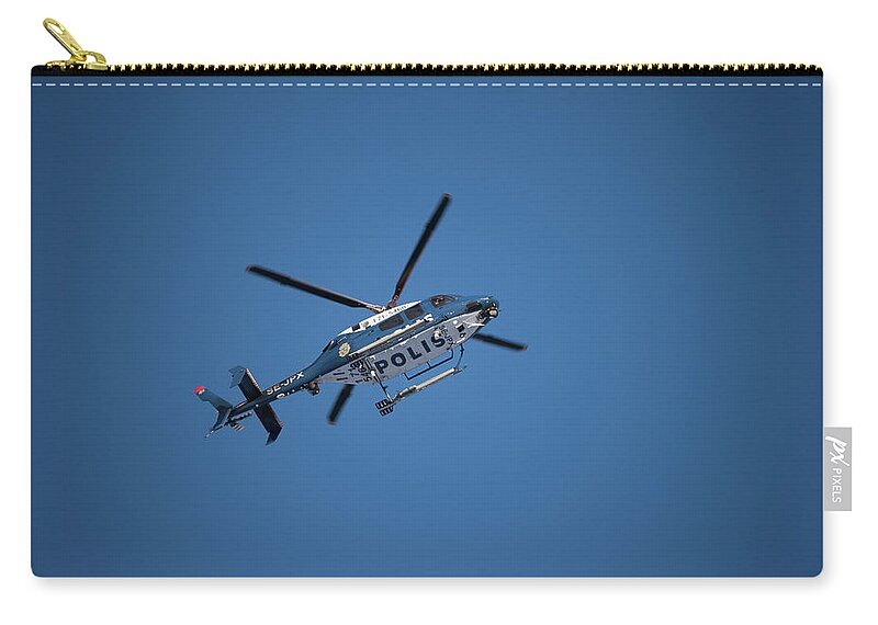 Swedish Police Helicopter Carry-all Pouch featuring the photograph The searcher in the air by Torbjorn Swenelius