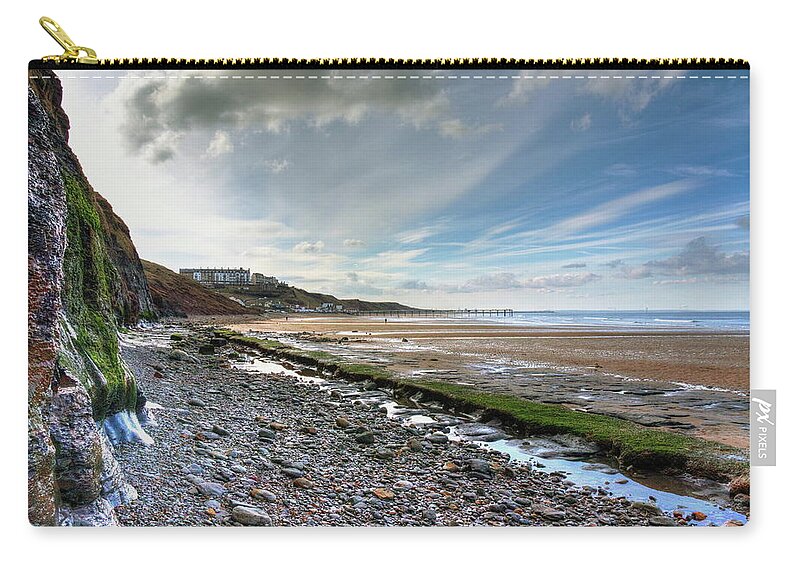 Seaside Zip Pouch featuring the photograph The Seaside town of Saltburn by Jeff Townsend