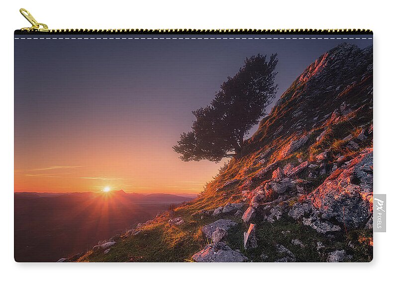 Lonely Zip Pouch featuring the photograph The sentinel by Mikel Martinez de Osaba