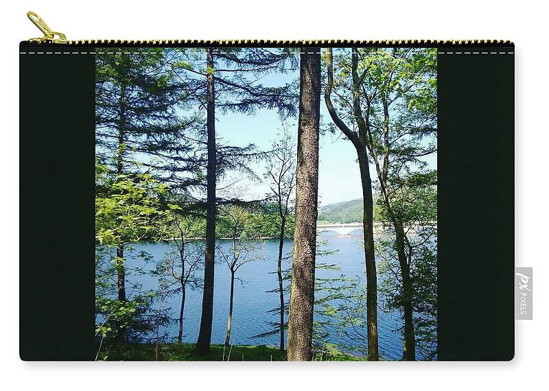  Zip Pouch featuring the photograph Through the trees by Rachel Phillips
