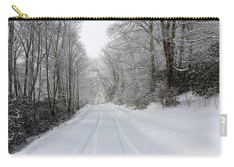 Snow Zip Pouch featuring the photograph Tire Tracks In Fresh Snow by D K Wall
