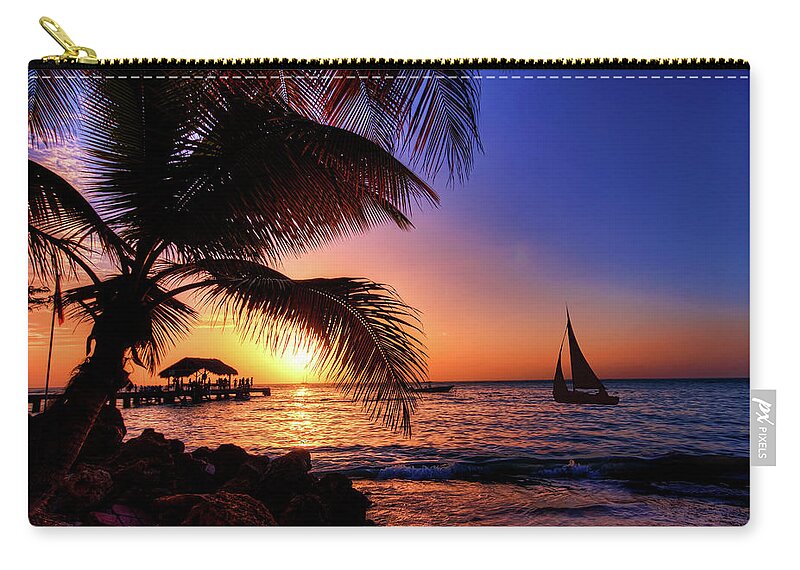Orange Sunset Zip Pouch featuring the photograph Tobago sunset by Sharon Ann Sanowar