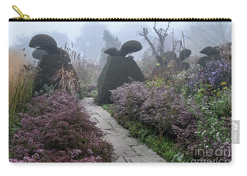 Topiary Zip Pouch featuring the photograph Topiary Peacocks in the Autumn Mist, Great Dixter by Perry Rodriguez