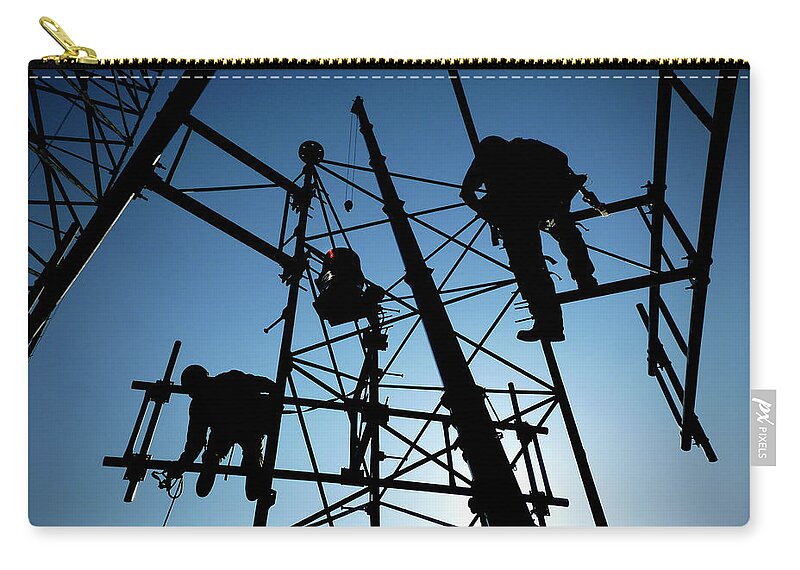 Tower Steel Climbing Safety Rescue Blue Silhouette Sun Crane Boom Communications Cell Cellular Antenna Beacon Black Workers Cellphones Fall Protection Osha Rigging Heights Tower Technician Rope Work Ropes Aerial High Harness Zip Pouch featuring the photograph Tower Tech by Bob Geary