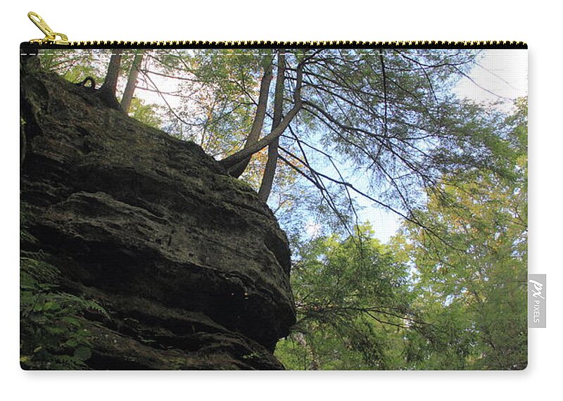 Old Man's Cave Zip Pouch featuring the photograph Trees Hanging Over Cliff by Angela Murdock