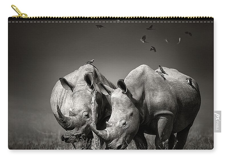 Rhinoceros Zip Pouch featuring the photograph Two Rhinoceros with birds in BW by Johan Swanepoel