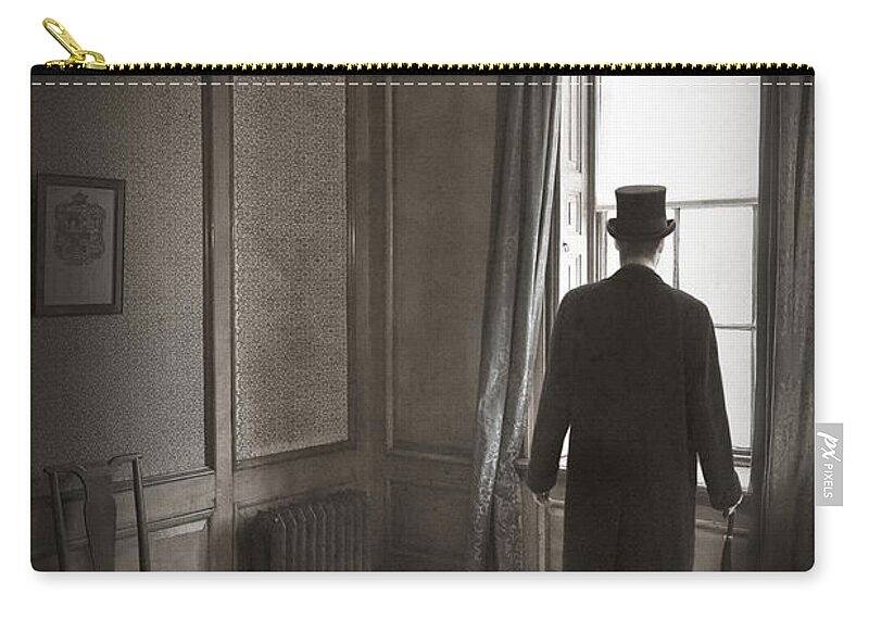 Man Zip Pouch featuring the photograph Victorian Or Edwardian Man With Top Hat Looking Out Of A Window by Lee Avison