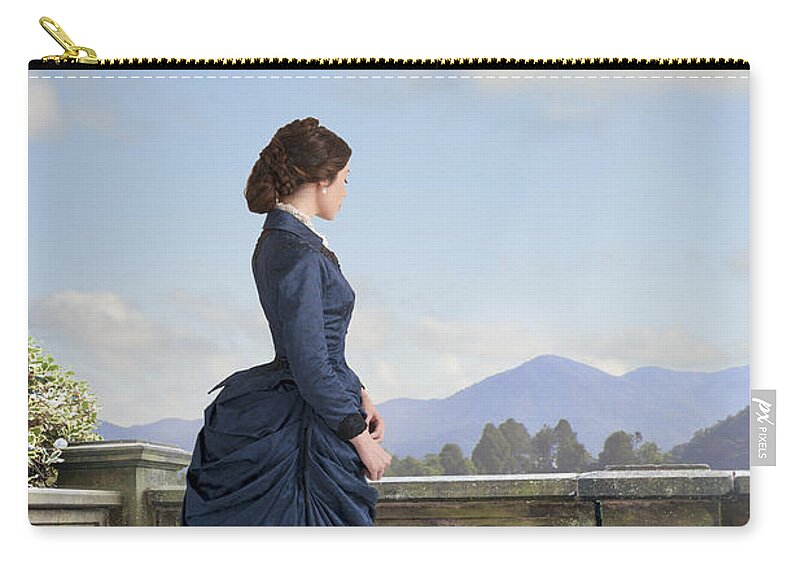 Victorian Zip Pouch featuring the photograph Victorian Woman In A Blue Dress Standing On The Terrace by Lee Avison