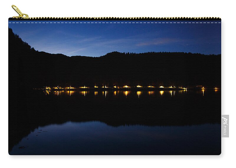 Bled Lake Zip Pouch featuring the photograph View across Lake Bled at night by Ian Middleton