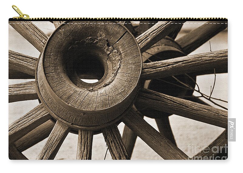 Old-west Zip Pouch featuring the photograph Wagon Wheel Hub by Kirt Tisdale