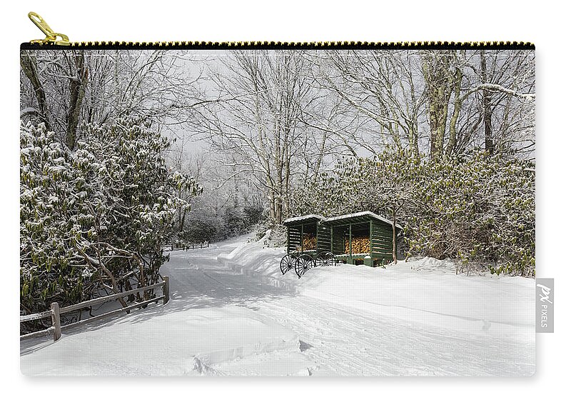 Snow Zip Pouch featuring the photograph Wagon Wheels and Firewood by D K Wall