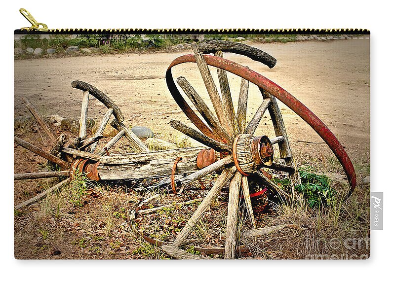 Yukon Zip Pouch featuring the photograph Wagon Wheels by Linda Bianic