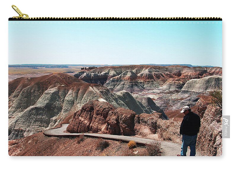 Travel Zip Pouch featuring the photograph Walking through The Painted Desert by Mary Capriole