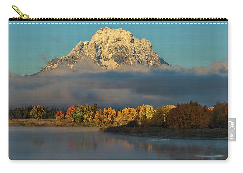 Mount Moran Zip Pouch featuring the photograph Watching Light Dispel Darkness by Yeates Photography