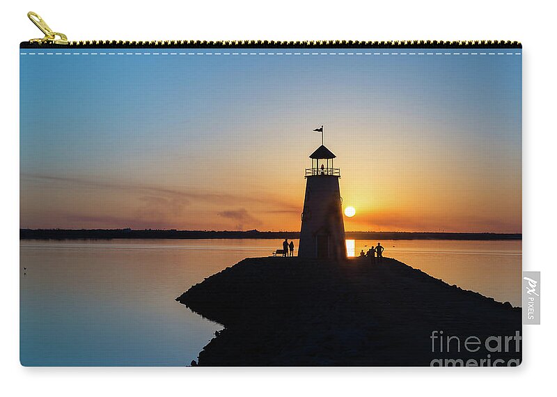 Lighthouse Zip Pouch featuring the photograph Watching the sunset under the lighthouse by Paul Quinn