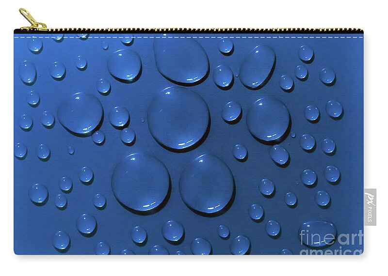 Water Carry-all Pouch featuring the photograph Water drops pattern on blue background by Simon Bratt