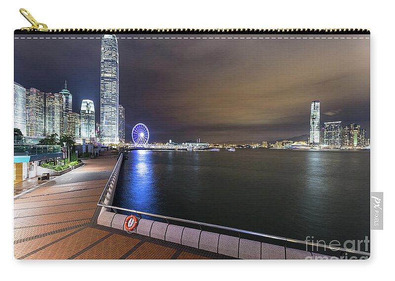 China Zip Pouch featuring the photograph Waterront promenade along the Victoria harbour in Hong Kong by Didier Marti