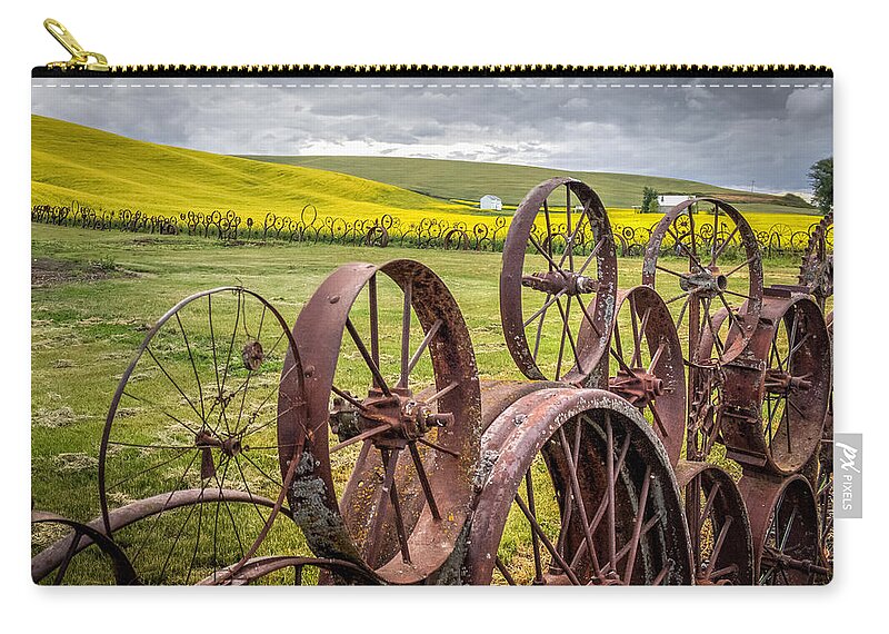 Wheel Zip Pouch featuring the photograph Wheel Fence and Canola Field by Brad Stinson