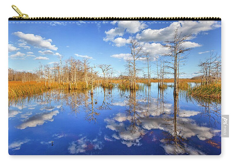 Clouds Carry-all Pouch featuring the photograph White Clouds over the Everglades by Debra and Dave Vanderlaan