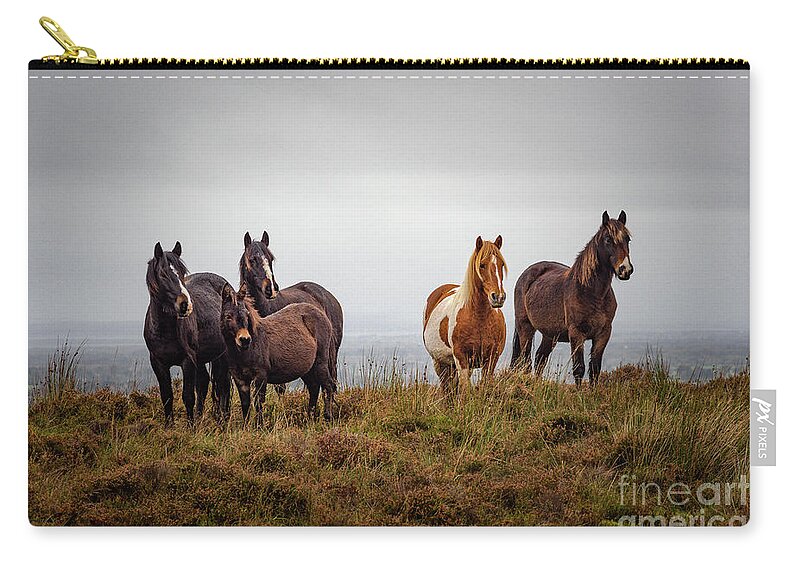 Ireland Zip Pouch featuring the photograph Wild horses in Ireland by Juergen Klust