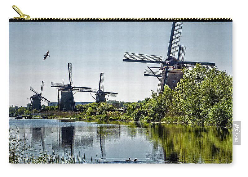 Kinderdijk Zip Pouch featuring the photograph Windmills of Kinderdijk, Netherlands by Phil Cardamone