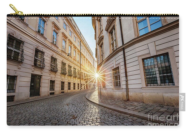 Outdoor Zip Pouch featuring the photograph winter sun between two buildings in Vienna by Ariadna De Raadt