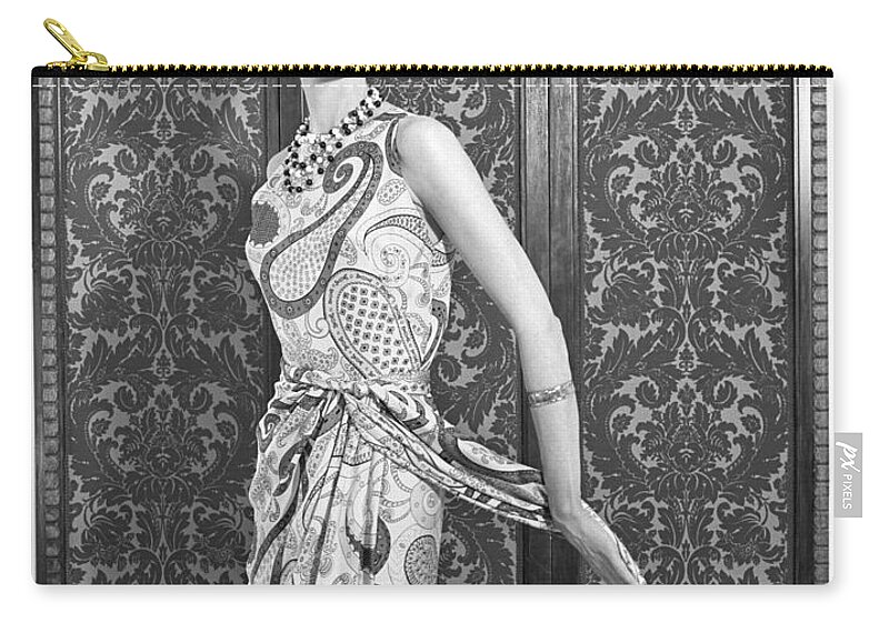 1960s Zip Pouch featuring the photograph Woman In Paisley Dress, 1960 by H. Armstrong Roberts/ClassicStock